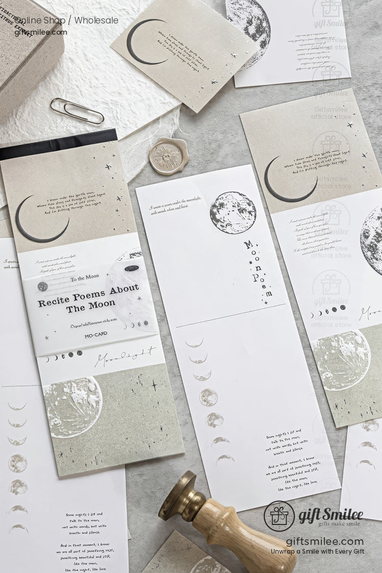 Minimalist moon-themed stationery set with celestial designs and neutral tones, displayed flat lay for a gift or journal collection.