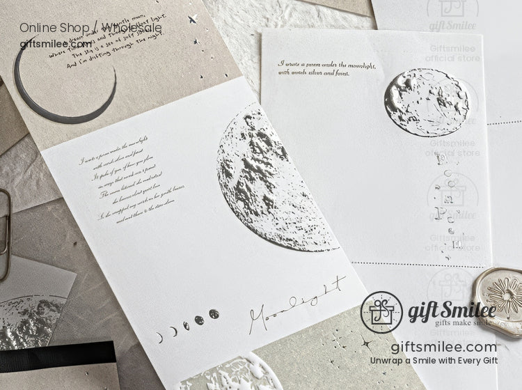 Minimalist moon-themed embossed greeting cards with silver foil lunar phases by giftSmile, flat lay on neutral background.