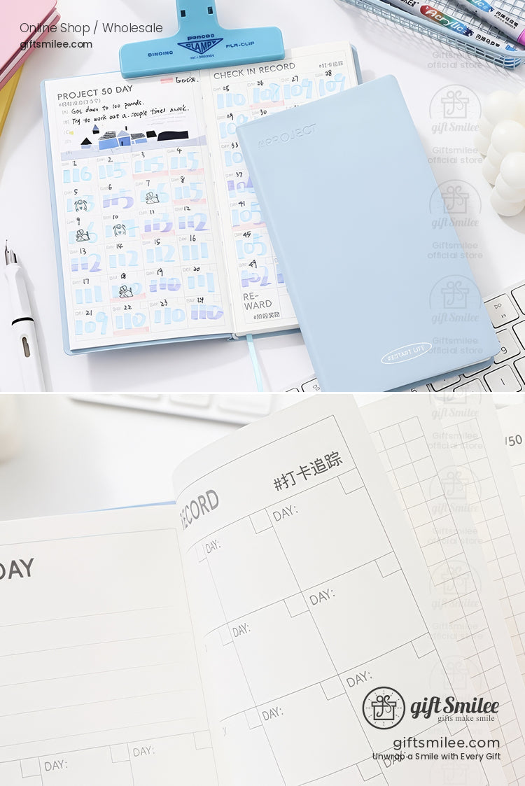 Pastel blue 50-day habit tracker notebook with check-in record pages open on a desk, ideal for goal planning and productivity.