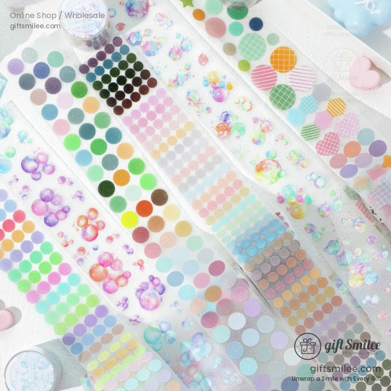 Close-up of holographic washi tape featuring pastel dots, stars, and glitter effects