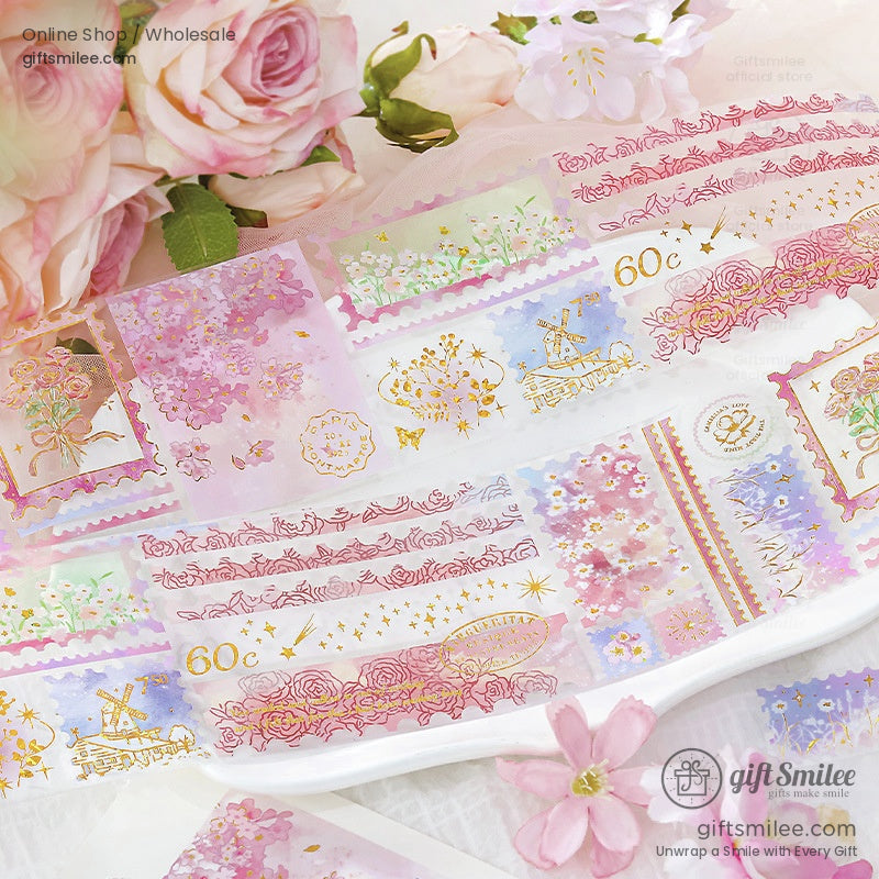 A vibrant collection of floral and vintage-themed washi tape rolls with gold foil accents, perfect for crafts and journaling
