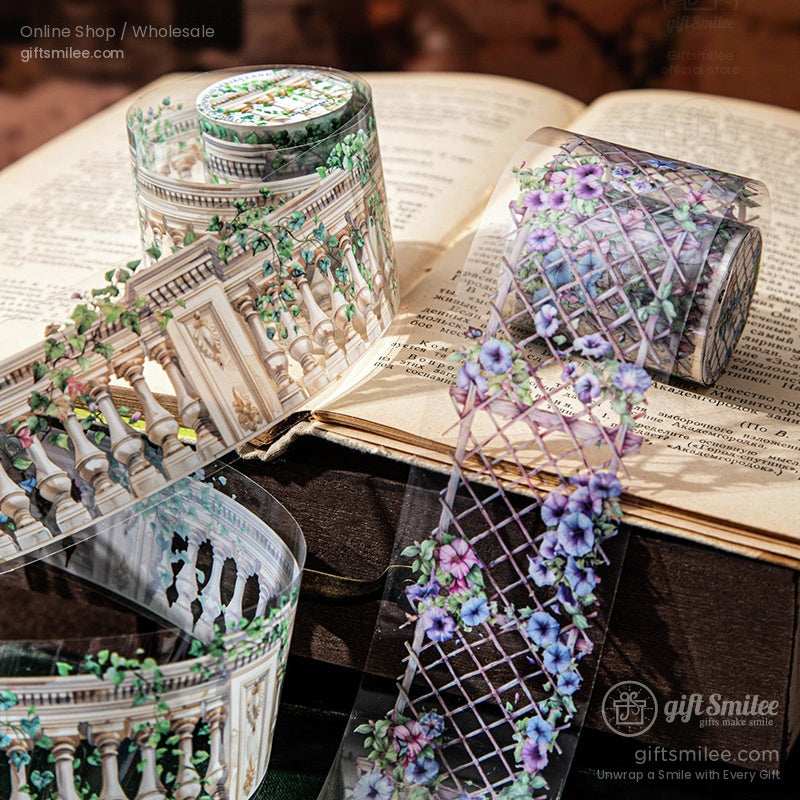 Decorative floral washi tape rolls with balcony and trellis designs displayed on an open vintage book for scrapbooking and journaling.