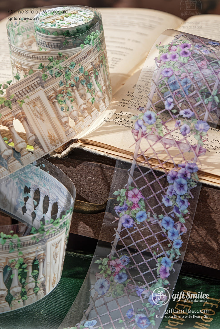 Floral garden-themed washi tape rolls on an open book, featuring trellis and balcony designs for scrapbooking and journaling.
