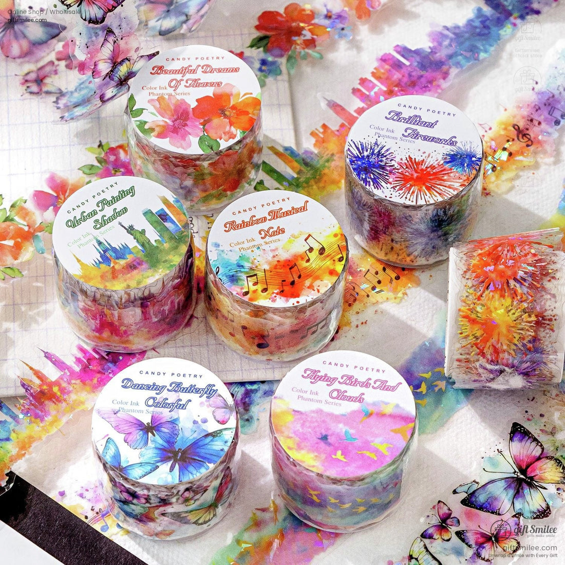Rainbow watercolor washi tape set with floral, butterfly, skyline, and music note designs for scrapbooking and journaling
