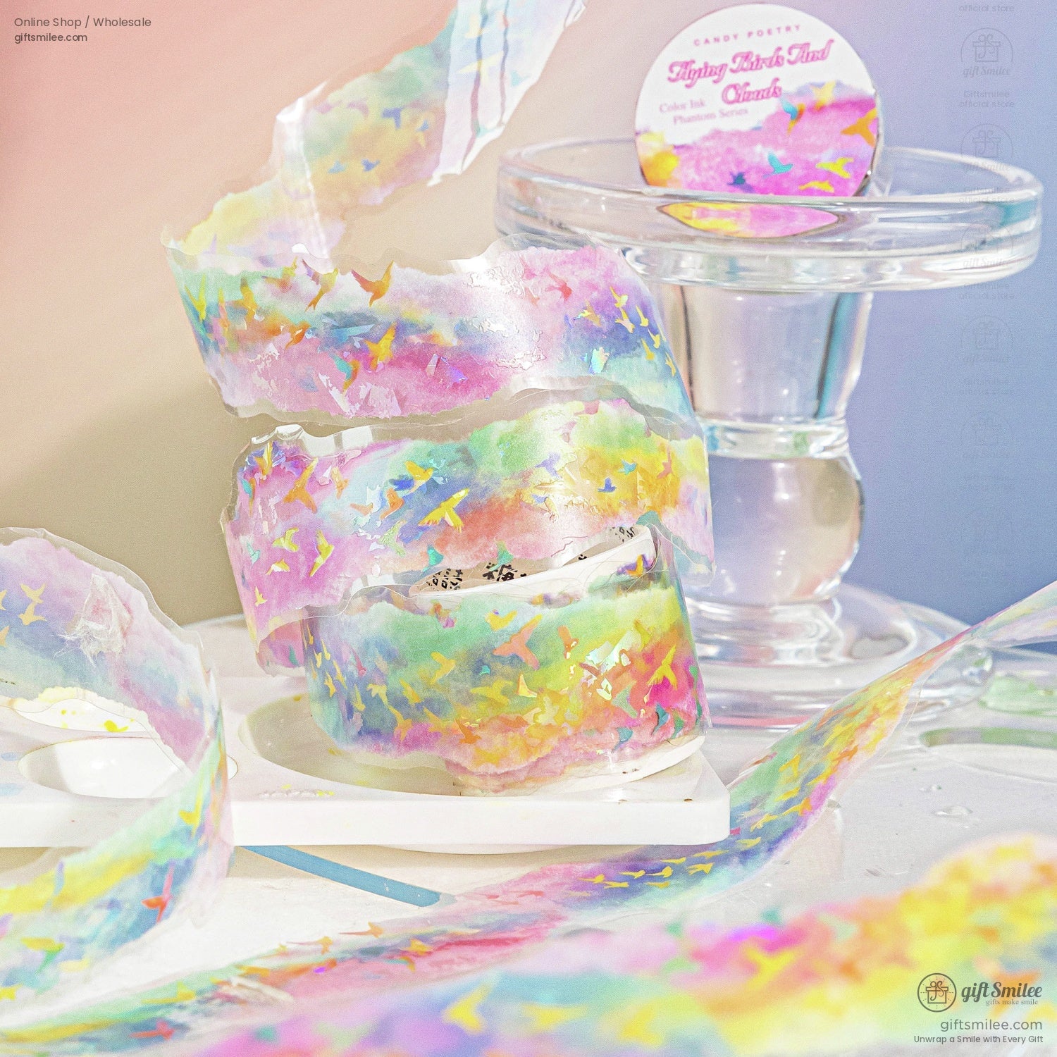 Holographic rainbow washi tape with flying bird pattern displayed on clear stand – Candy Poetry “Flying Birds Trail” phantom series for scrapbooking and crafts.