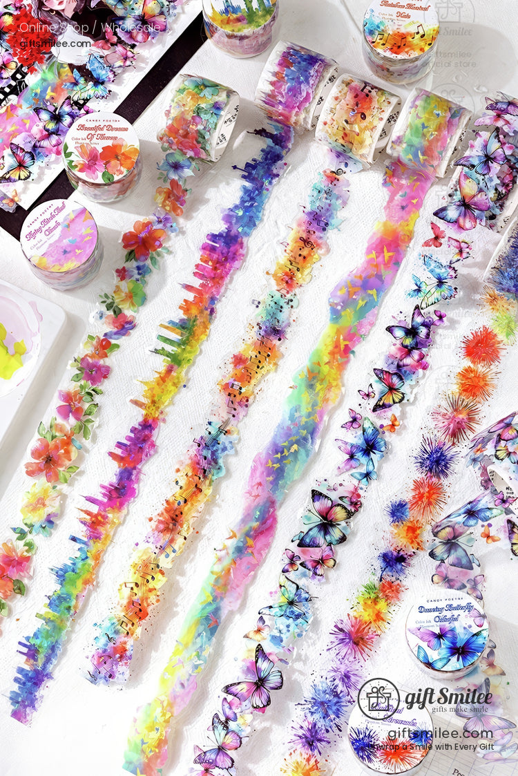 Colorful floral and butterfly washi tape rolls and strips for scrapbooking and crafts displayed on a white background.