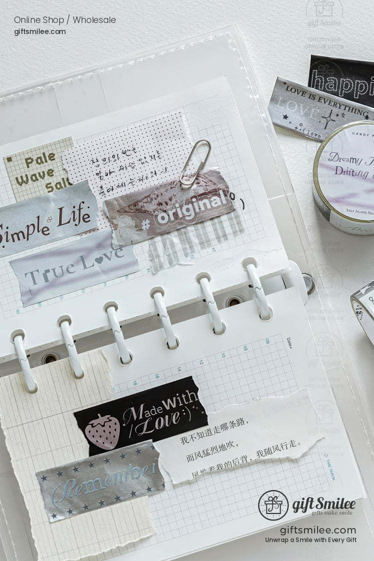 Minimalist scrapbook journal with neutral washi tape labels and stickers laid out on a ring binder, giftsmilee stationery supplies.