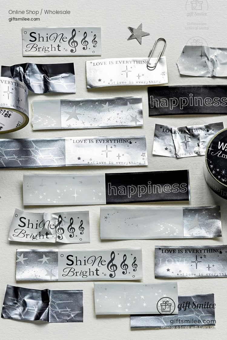 Silver and black decorative washi tape set with “Shine Bright,” “Love Is Everything,” stars, and “happiness” text strips displayed flat for scrapbooking and gift wrap.