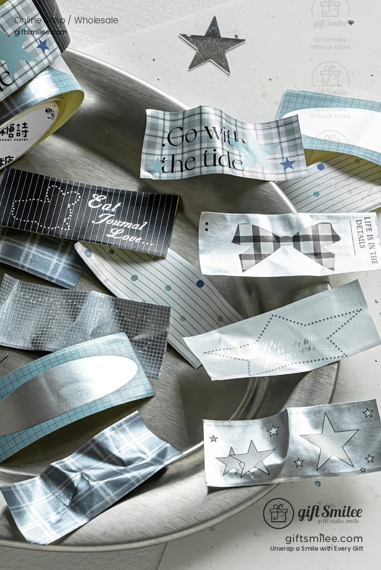 Silver and blue metallic washi tapes with stars and inspirational text arranged on a plate – decorative stationery by giftSmilee for scrapbooking and journaling.