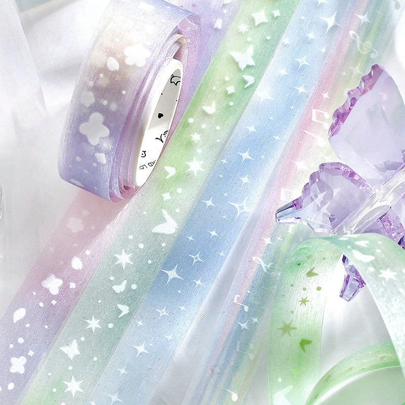 Pastel washi tapes in lavender green and blue with white star butterfly and floral patterns paired with acrylic decor