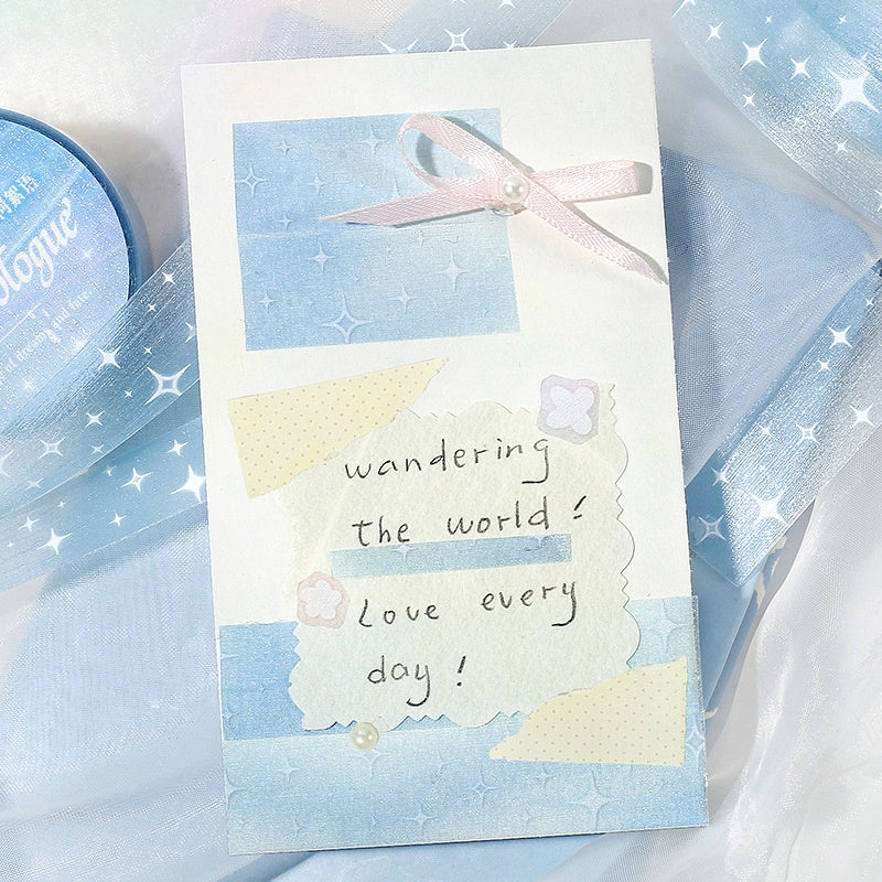 Pastel blue and white stationery card with handwritten message star patterns pearl accents and a pink ribbon bow