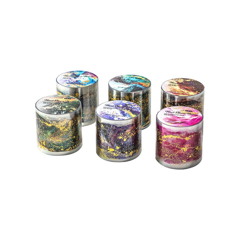 Colorful marbled washi tape rolls with metallic gold accents in shades of purple green blue and pink