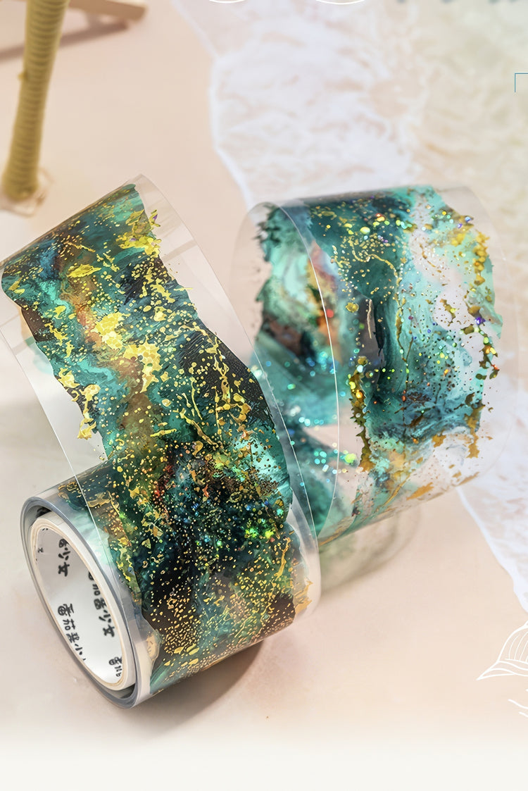 Transparent decorative tape with abstract teal green gold foil patterns and shimmering accents ideal for crafts