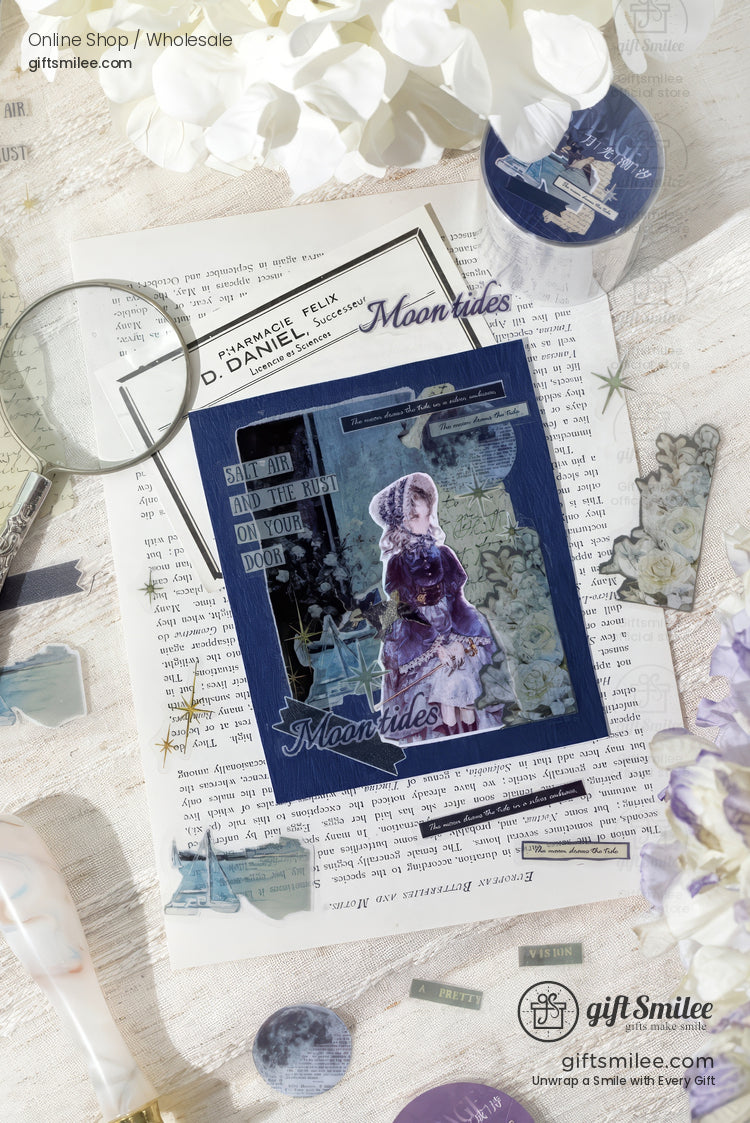 Vintagestyle scrapbook with navy blue accents delicate floral stickers and a translucent figure on textured paper