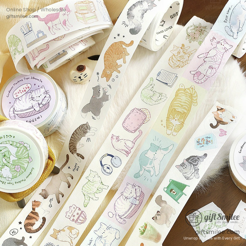 Pastelcolored washi tape rolls with playful cat illustrations including orange tabby gray and white cats in various poses