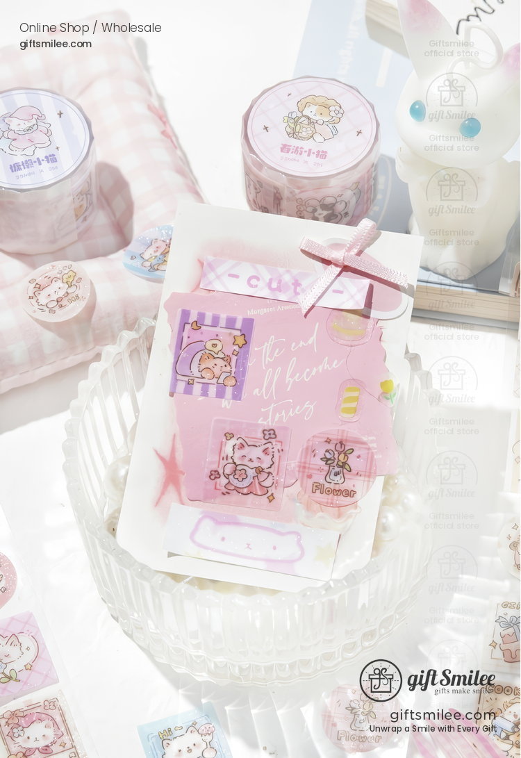 Pastel pink and purple stationery set with cute animalthemed stickers and decorative tape in a glass bowl
