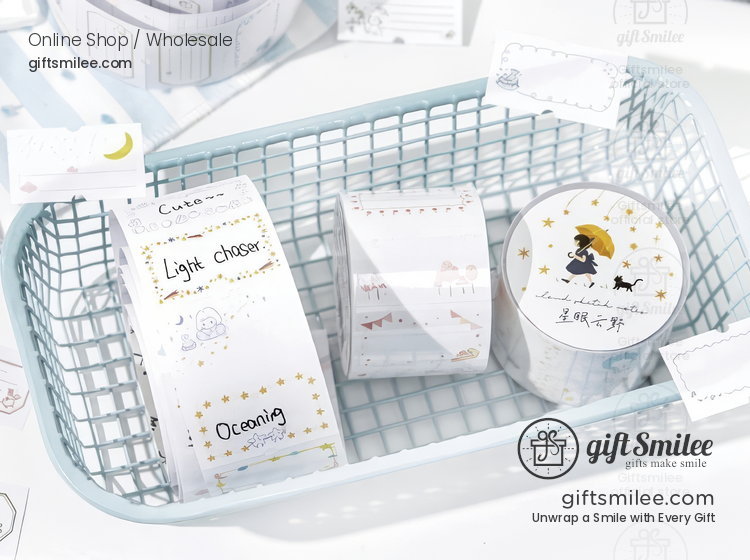 Pastel blue plastic basket with decorative washi tape rolls featuring gold stars illustrations and whimsical designs