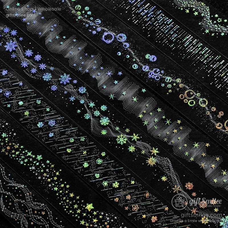 Holographic black washi tapes with iridescent star snowflake and bubble patterns in vibrant green blue and gold