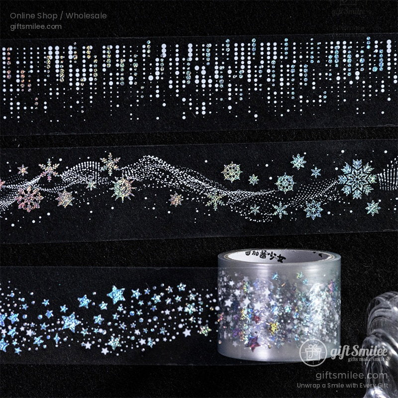 Transparent decorative tape with holographic snowflakes stars and dotted patterns on a black background