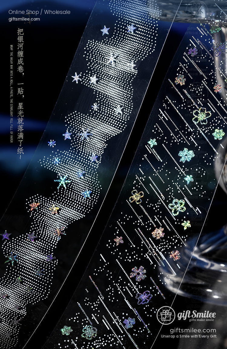 Transparent decorative tape with holographic stars floral patterns and dotted galaxy design on a dark background