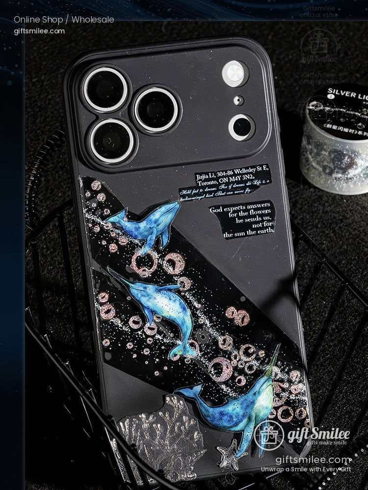 Black phone case with blue dolphin artwork glitter accents inspirational text and a sleek glossy finish