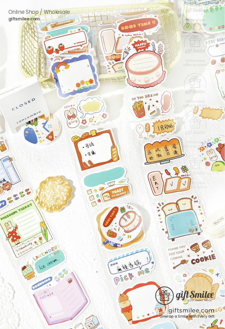 Colorful paper stickers with cute bakery and food designs including cakes toast and cookies displayed on a white surface