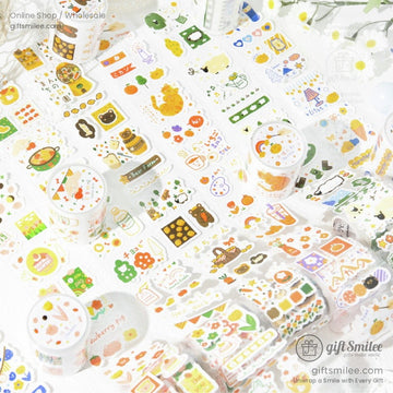 Colorful decorative stickers with playful animal food and nature designs on glossy white rolls and sheets