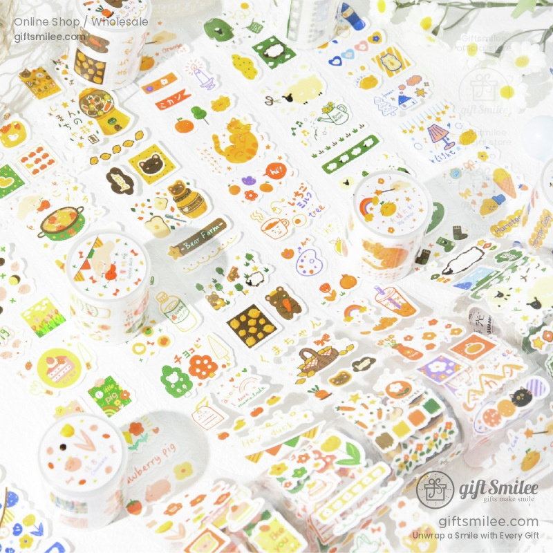 Colorful decorative stickers with playful animal food and nature designs on glossy white rolls and sheets