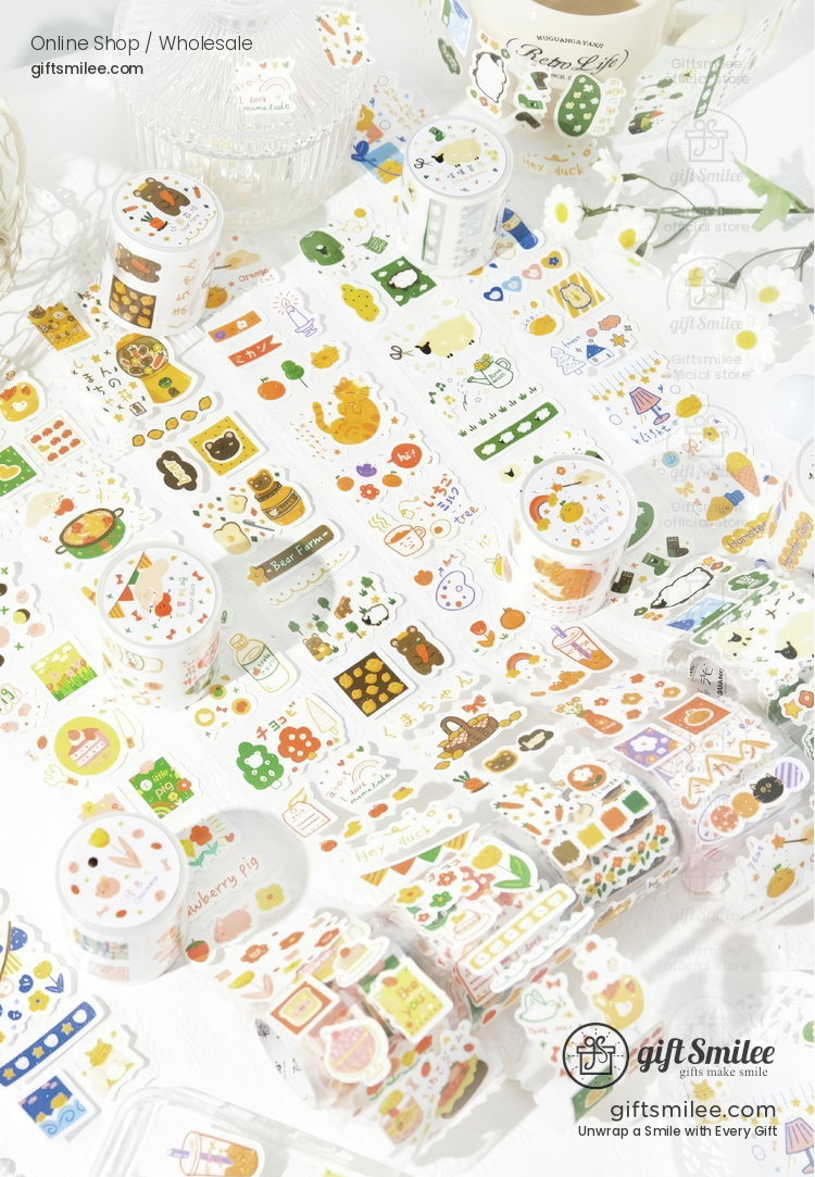 Colorful decorative washi tape rolls and sticker sheets with food plant and nature designs on a bright white surface