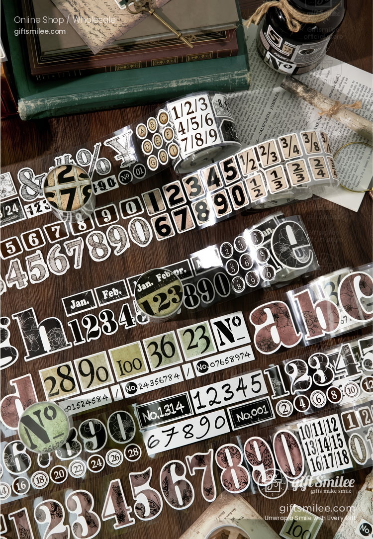 Vintagestyle washi tapes with numbers letters and calendar designs in neutral tones on a wooden desk with books