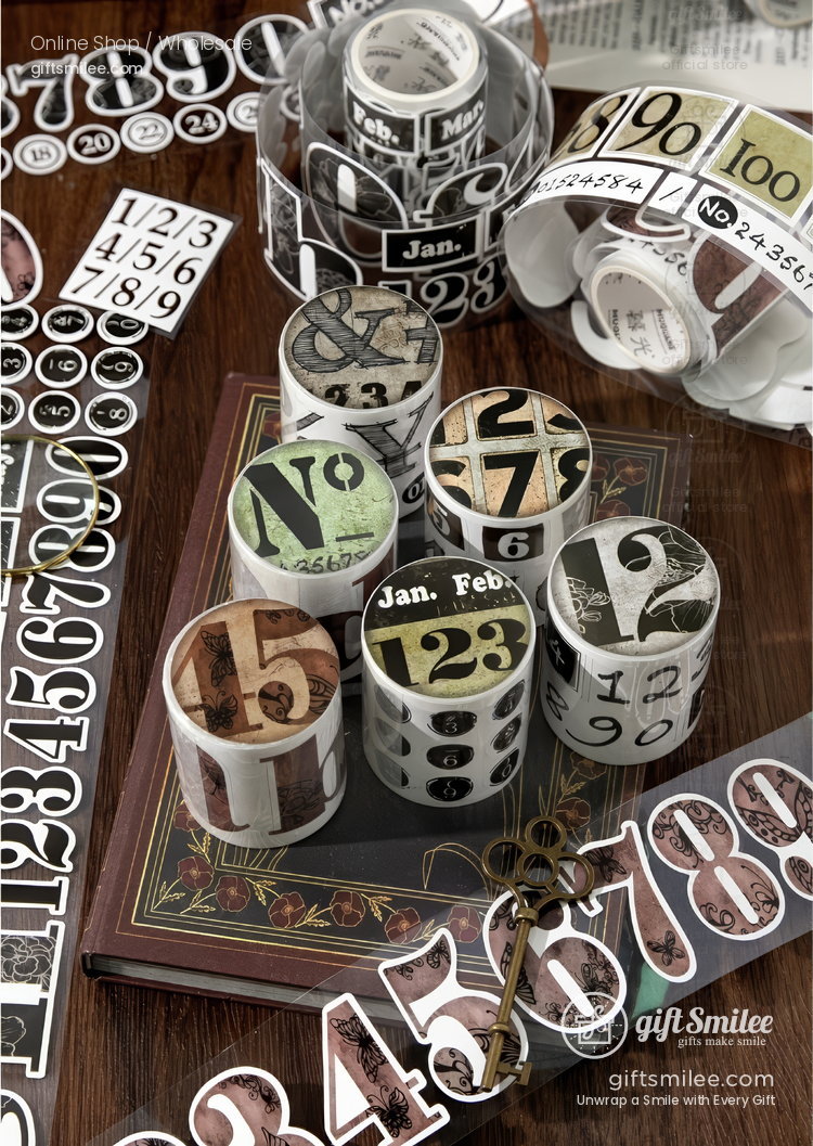 Vintagestyle numberthemed washi tape rolls in assorted colors on a wooden table paired with decorative stickers