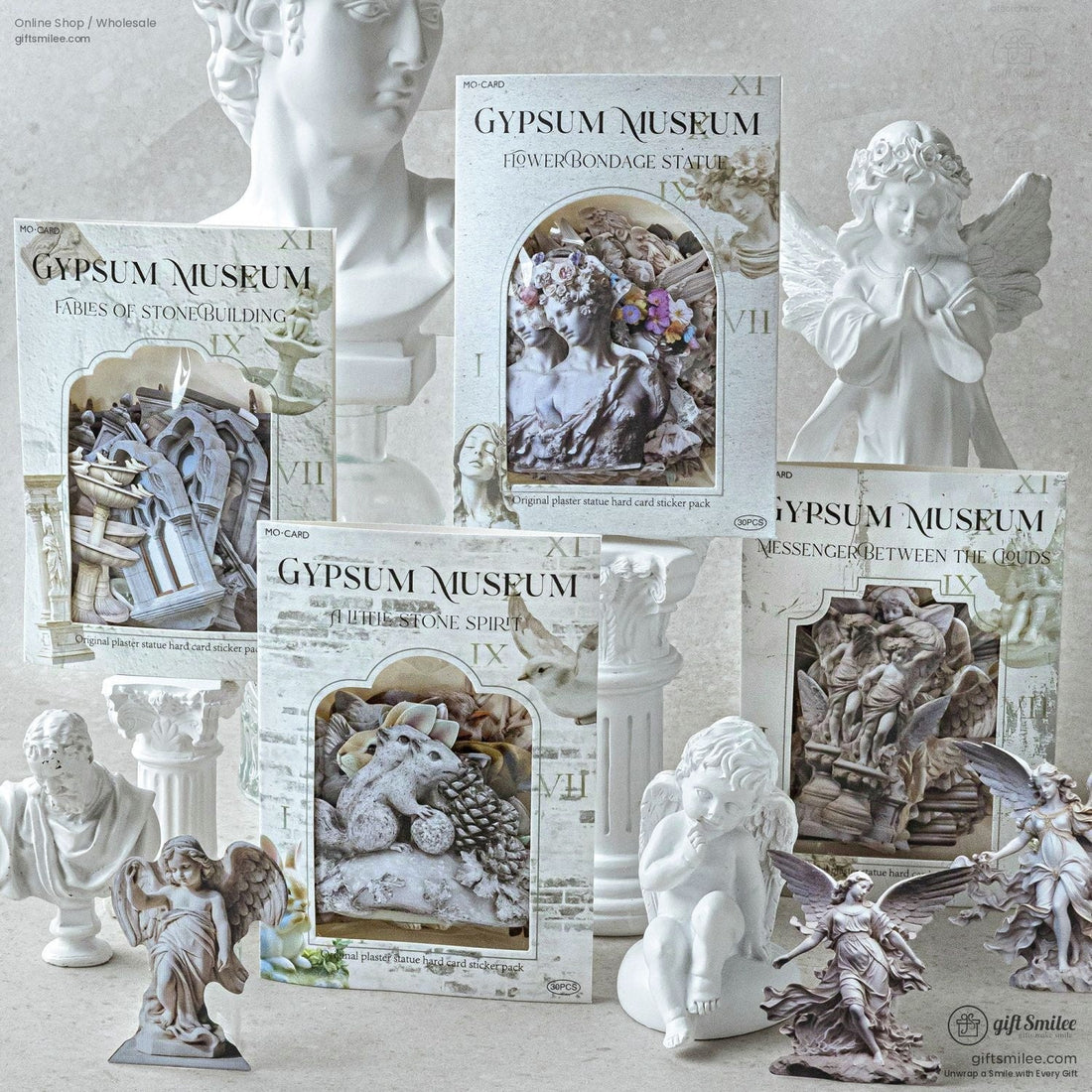 Close-up of vintage gypsum angel statue stickers on a decorative table with pearls and glassware