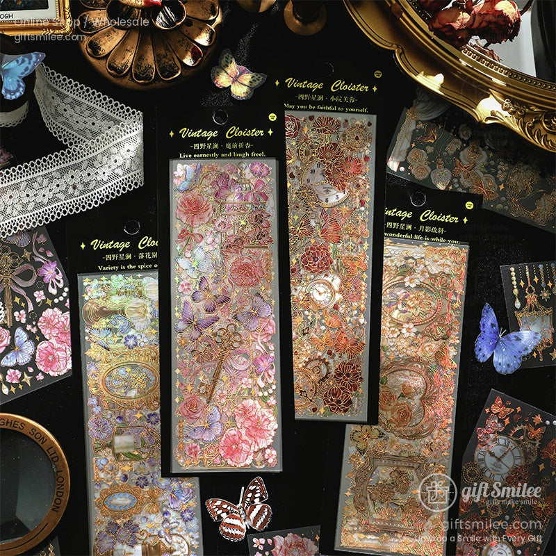Holographic floral and butterfly sticker sheets in vintage style being held in hands, decorative scrapbooking stickers for planners and crafts.