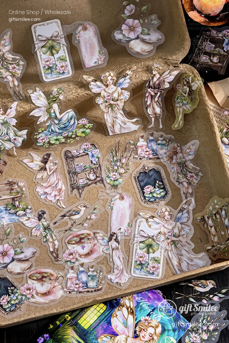 Vintage fairy and floral sticker set displayed in a kraft tray, whimsical pastel scrapbook stickers for journaling and crafts.