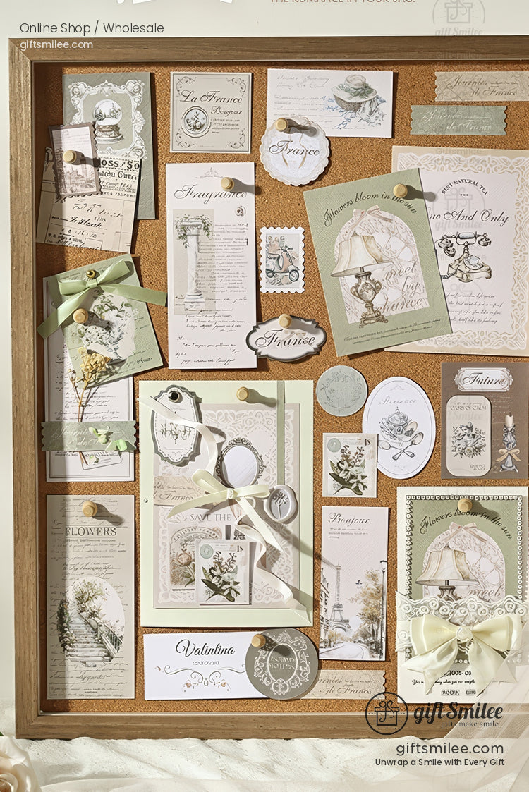 Vintage-inspired memo board with pastel green stationery, ribbons, and decorative labels pinned to a cork board for home decor or scrapbooking.