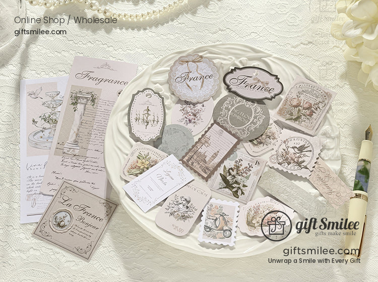 Vintage-style French label and floral sticker set displayed on a white plate, product flat lay by giftSmilee for scrapbooking and journaling.