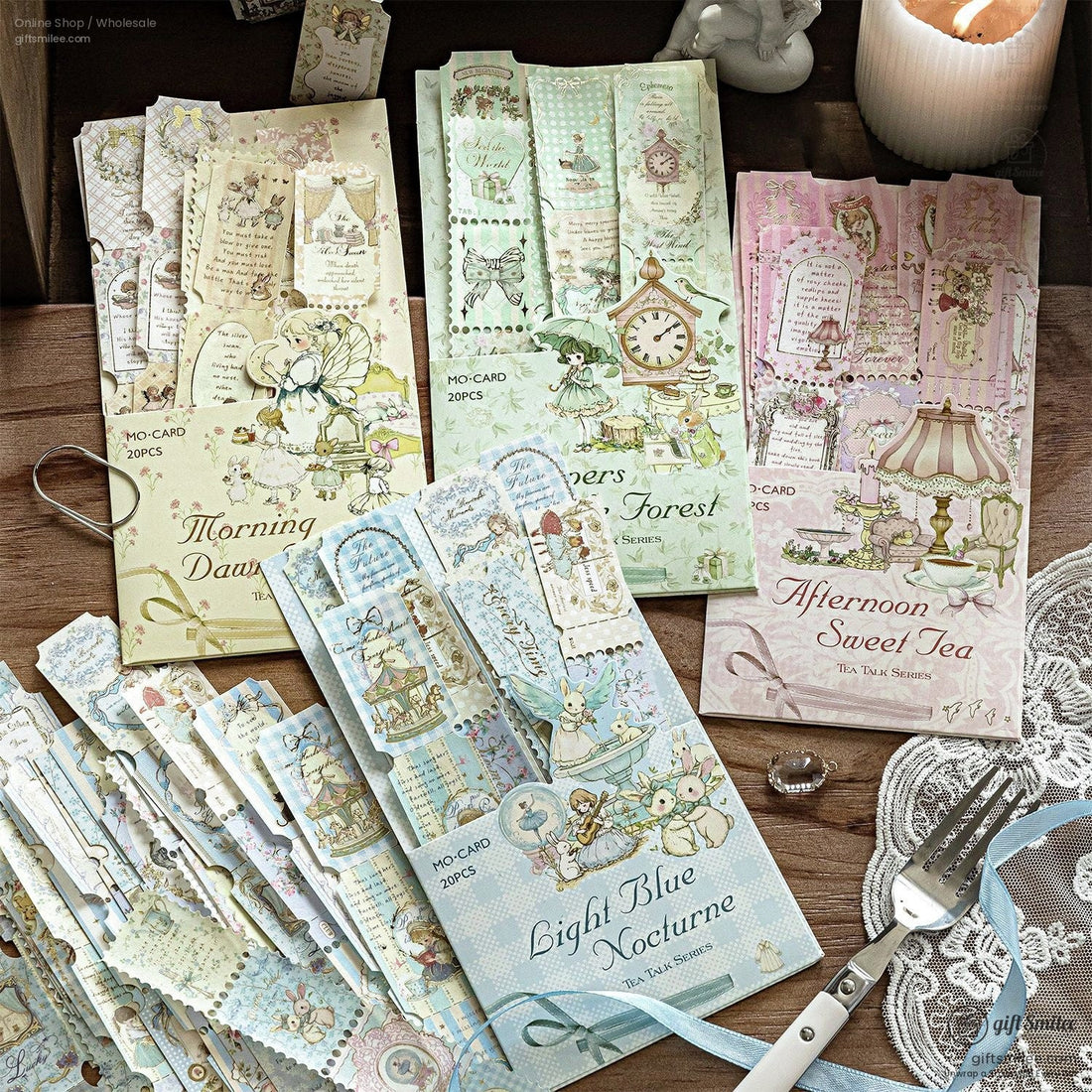 Vintage pastel tea-themed paper ephemera set – decorative journaling cards and bookmarks in Morning Dawn, Forest, Afternoon Sweet Tea, and Light Blue Nocturne designs on rustic table.