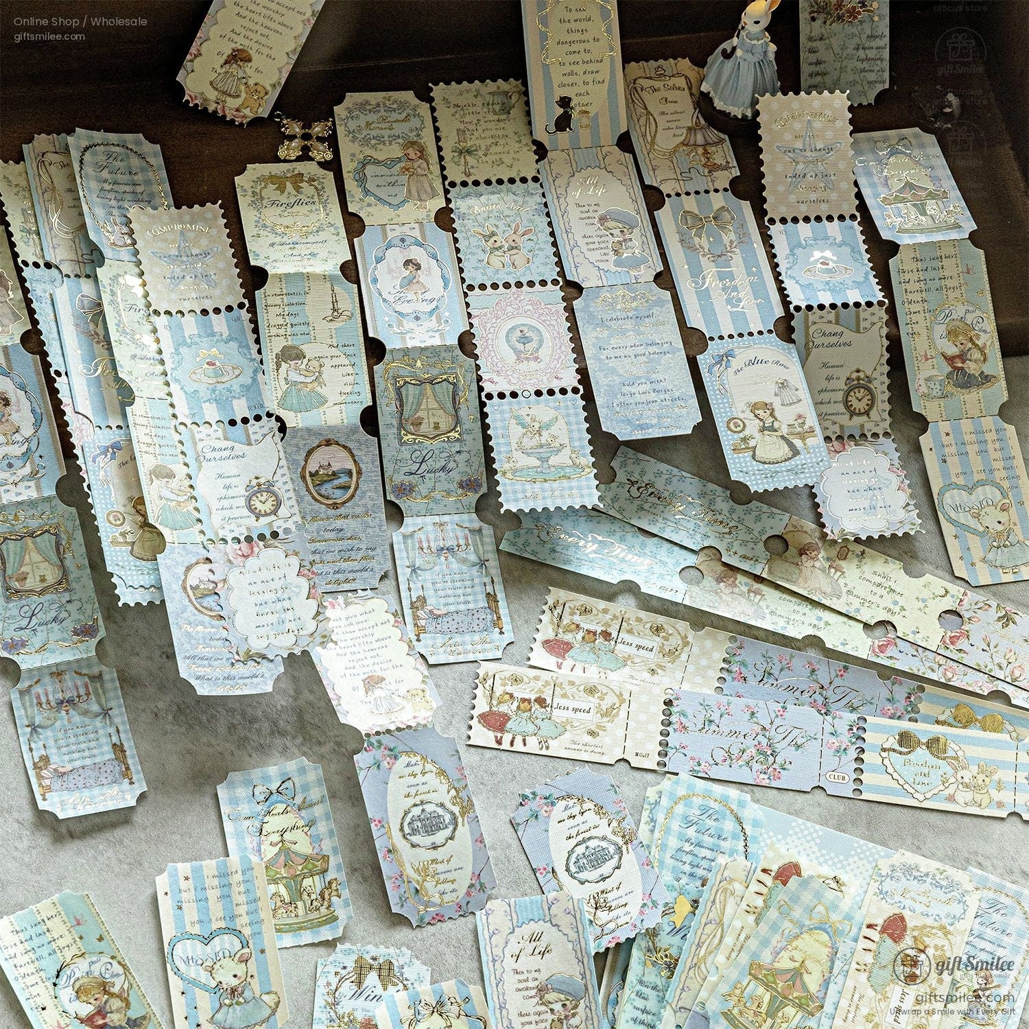 Vintage-style blue scrapbook tickets and labels laid out flat for journaling, planner, and craft embellishments