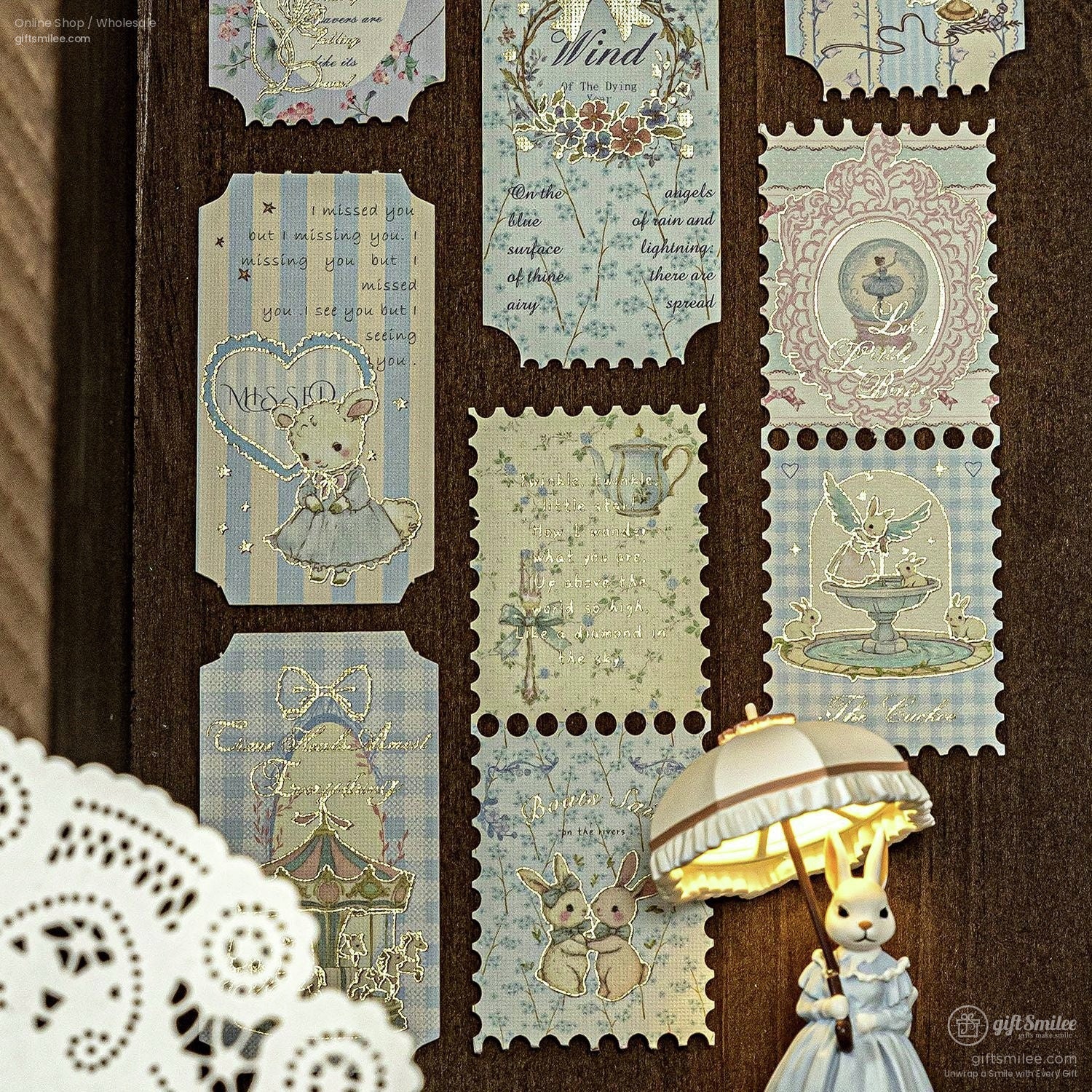 Vintage-style pastel sticker set on wooden board with cute animals, carousel, and floral designs for scrapbooking and journaling.