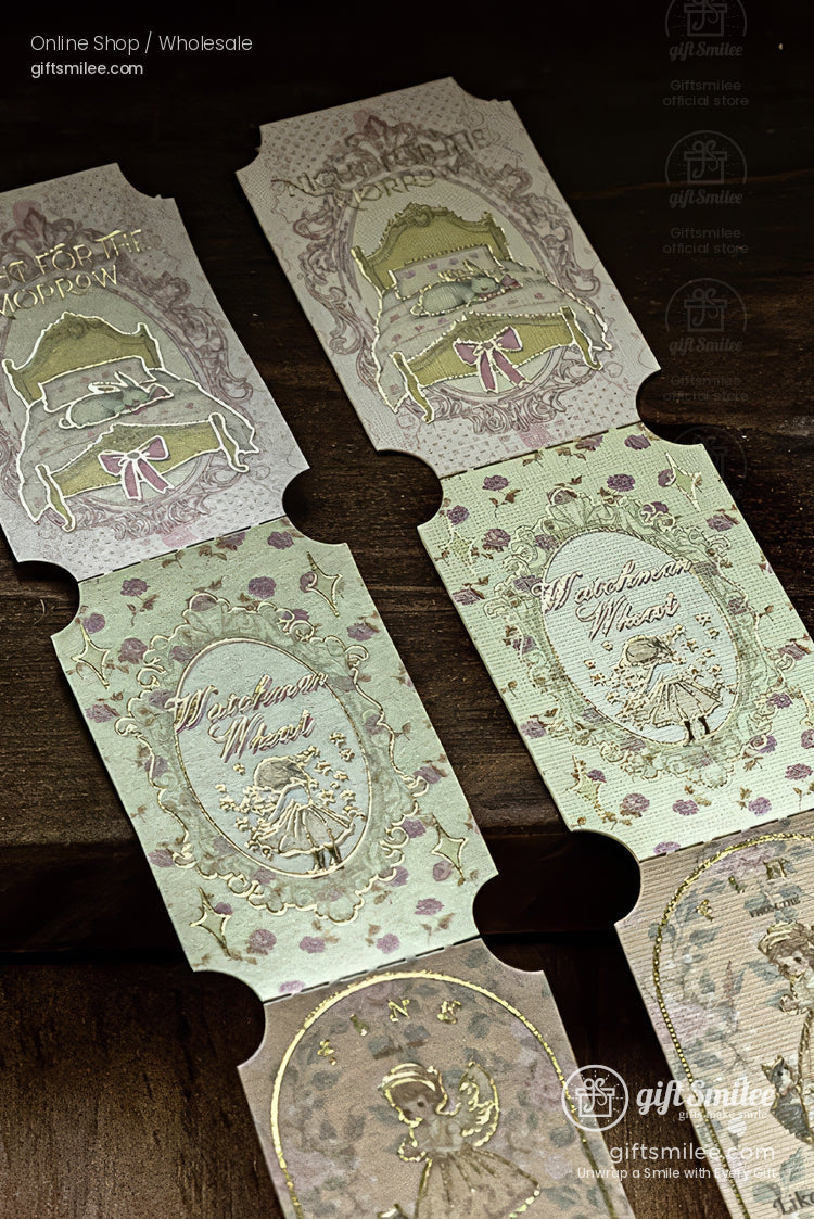Vintage-style decorative paper tickets with gold-foil embossed illustrations and floral patterns on a wooden background, giftsmile branding visible.