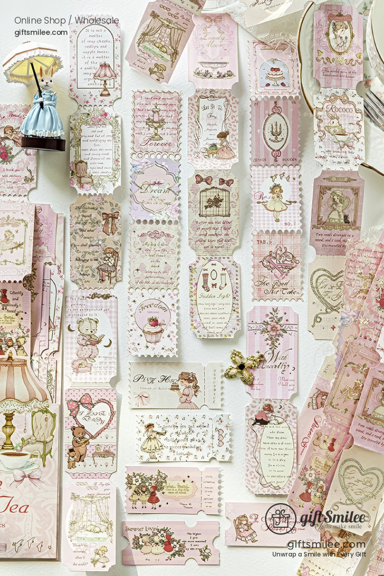 Pastel pink vintage-style gift tags and labels with cute illustrations and floral designs displayed on a white background.