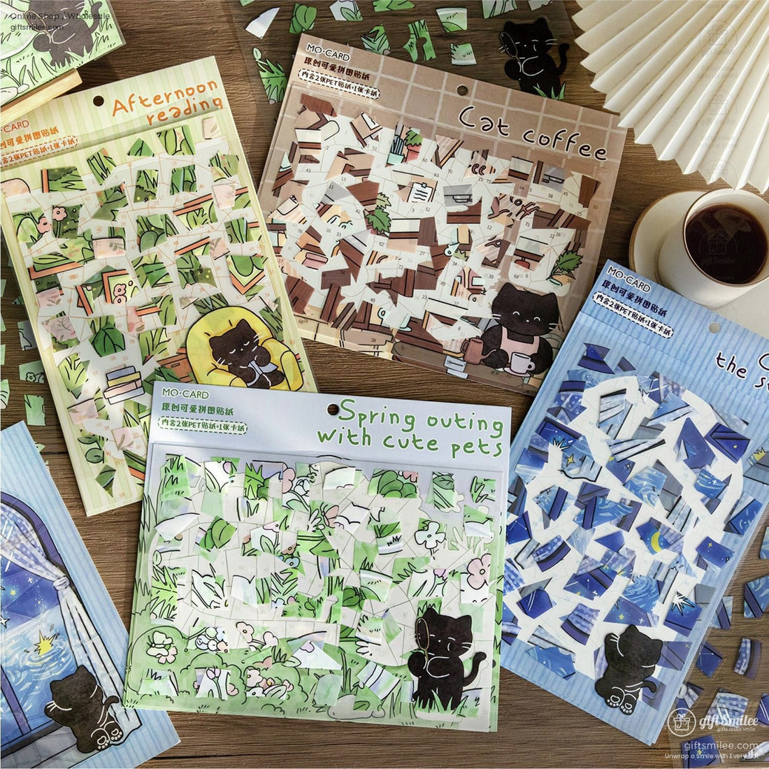 Person assembling a cute cat-themed mosaic puzzle on a wooden table, craft tweezers placing numbered pieces in a green garden scene.