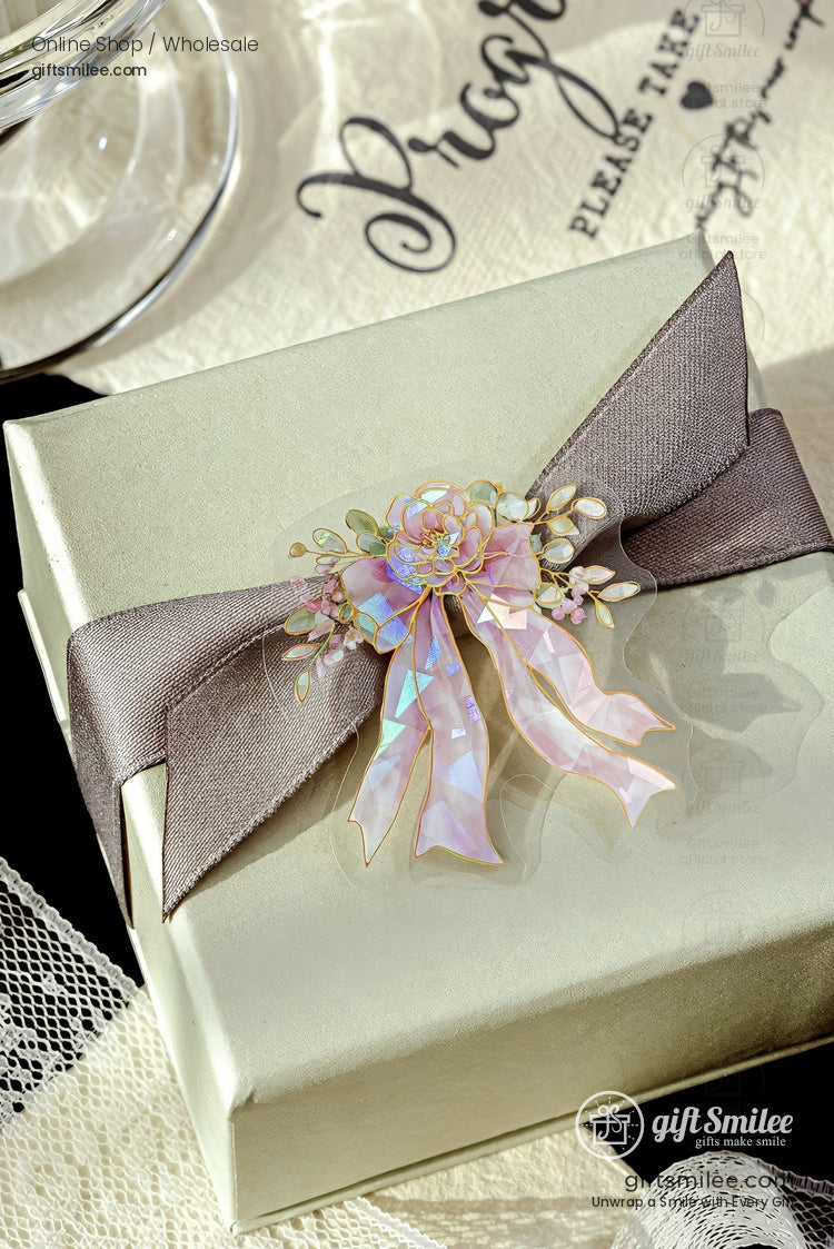 Elegant gift box with gray satin ribbon and iridescent floral bow, perfect for wedding or bridal shower favor