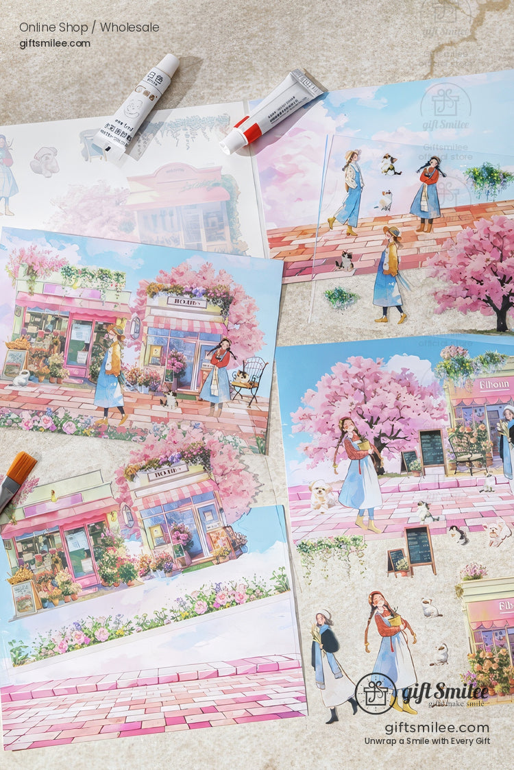 Pastel spring stationery prints with cherry blossom illustrations laid out on a desk — giftsmilee art prints for online shop and wholesale