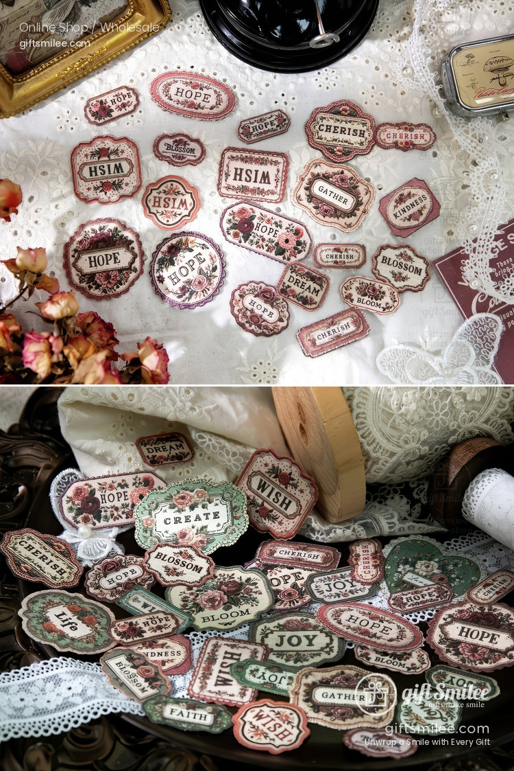 Vintage-style cardstock labels and stickers with words like “Hope,” “Joy,” and “Wish” for scrapbooking and journaling, displayed on lace and rustic décor.