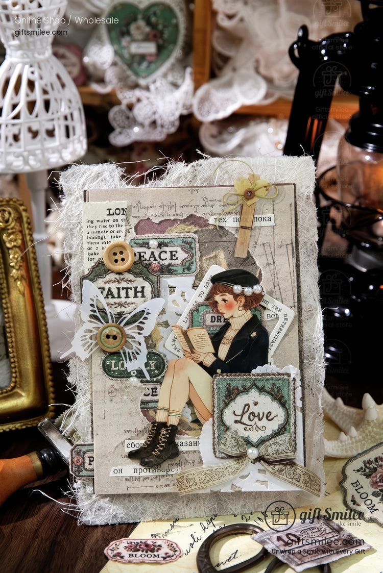 Vintage shabby-chic handmade scrapbook card with buttons, lace, and “Love” tag on rustic desk display