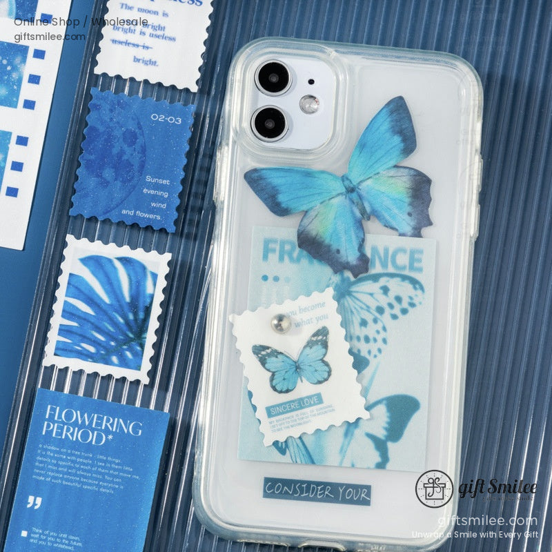 Transparent phone case with layered blue butterfly designs decorative text accents and aesthetic stampstyle graphics