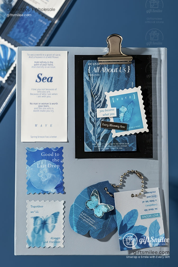 Assorted bluethemed stationery with butterfly motifs leaf designs and inspirational text on a silver clipboard