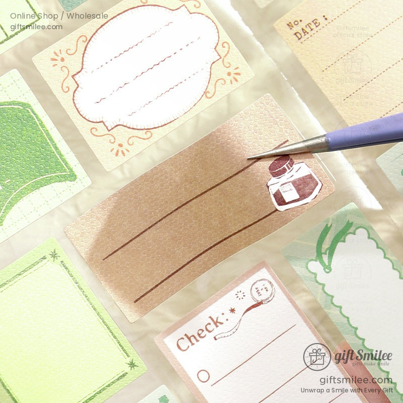 Vintagestyle adhesive labels in pastel tones featuring ornate borders lined spaces and an ink bottle illustration