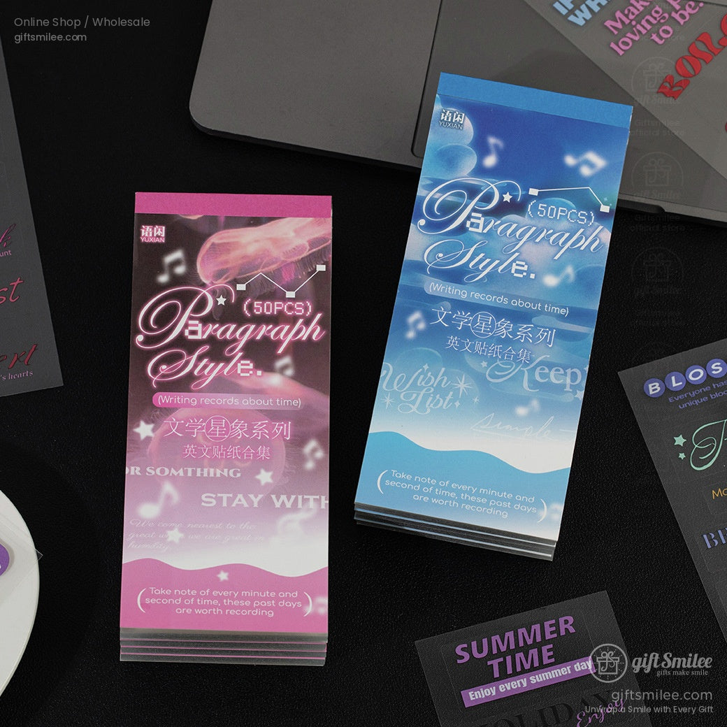Pink and blue gradient bookmarks with decorative fonts music note accents and motivational text placed on a black surface